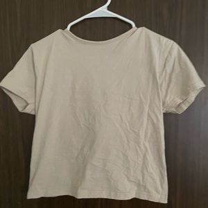 Tan tee with an open back